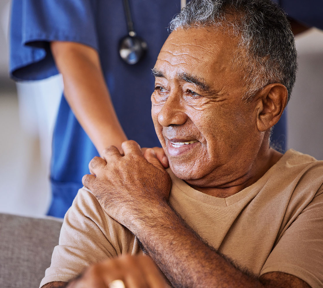 elder-man-touching-the-hand-of-the-nurse-when-it's-on-his-shoulder